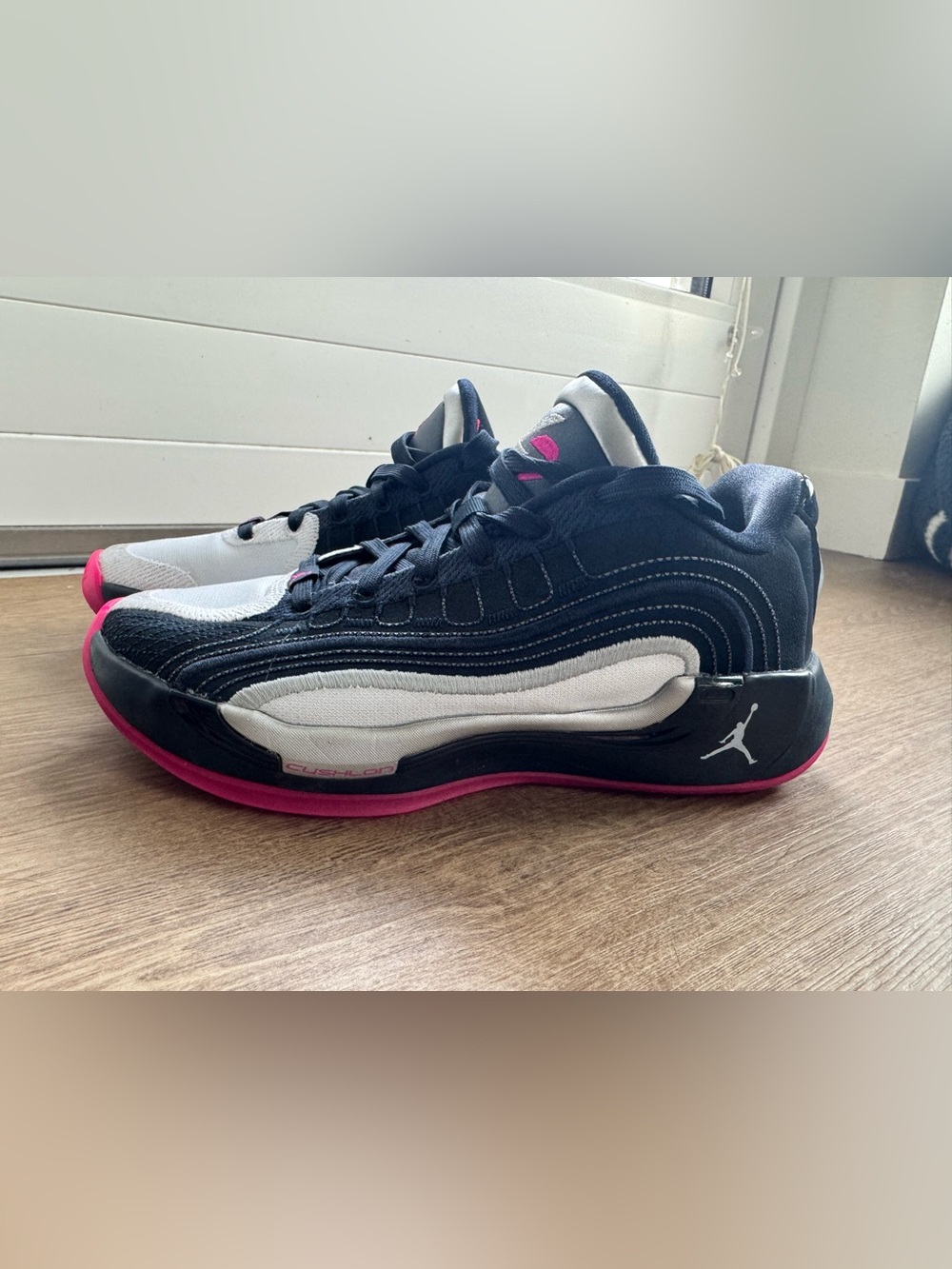 Nike Air Jordan Black and White Sneakers with Pink Accents